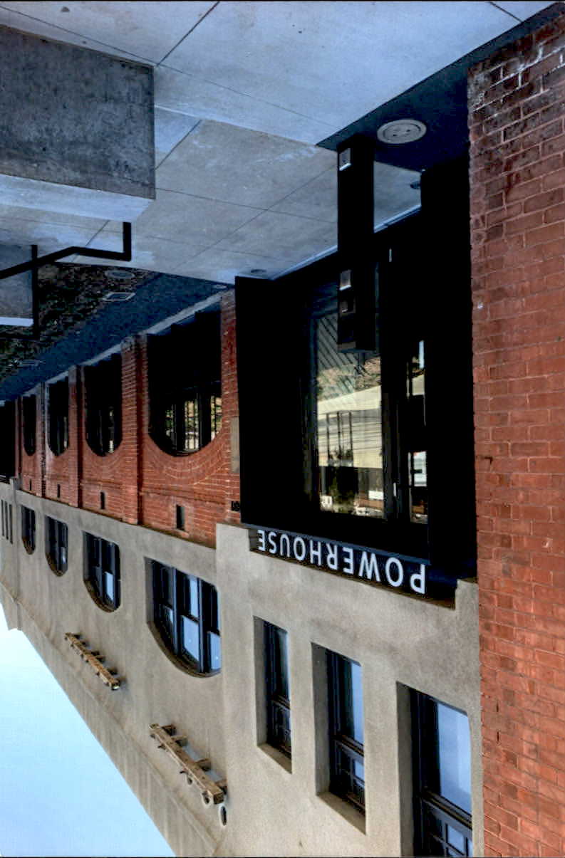 After Front of building showing renovated exterior and  new cement walkway 